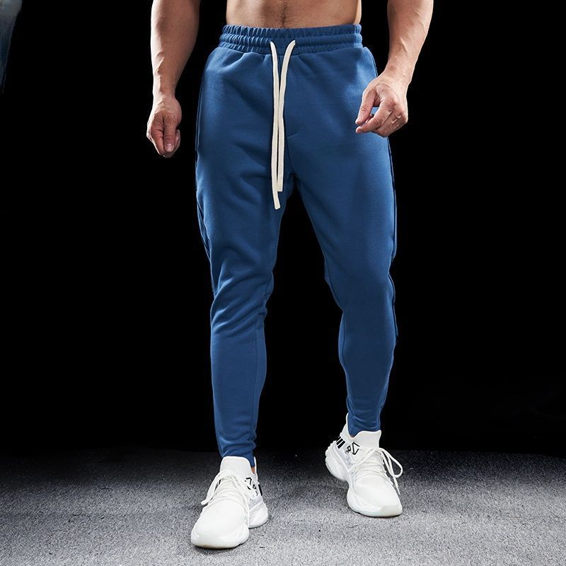 Slim-fit men's stretch running pants with zip pockets