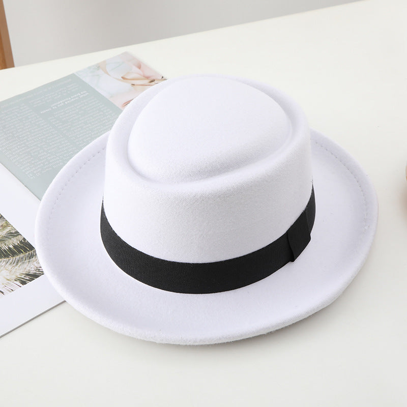 Black ribbon top hat, curved brim jazz hat.