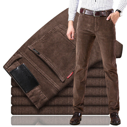 Brown corduroy pants displayed on a stack with a person wearing them.