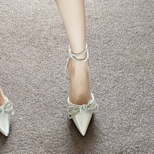 Pointed-toe mid-heel womens sandals with cross-buckle and rhinestone bow strap